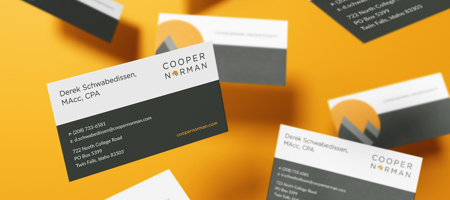 Several business cards for Cooper Norman featuring a modern, minimalist marketing design on a yellow background. The cards display contact details, a geometric logo, and black, white, and orange color blocks.